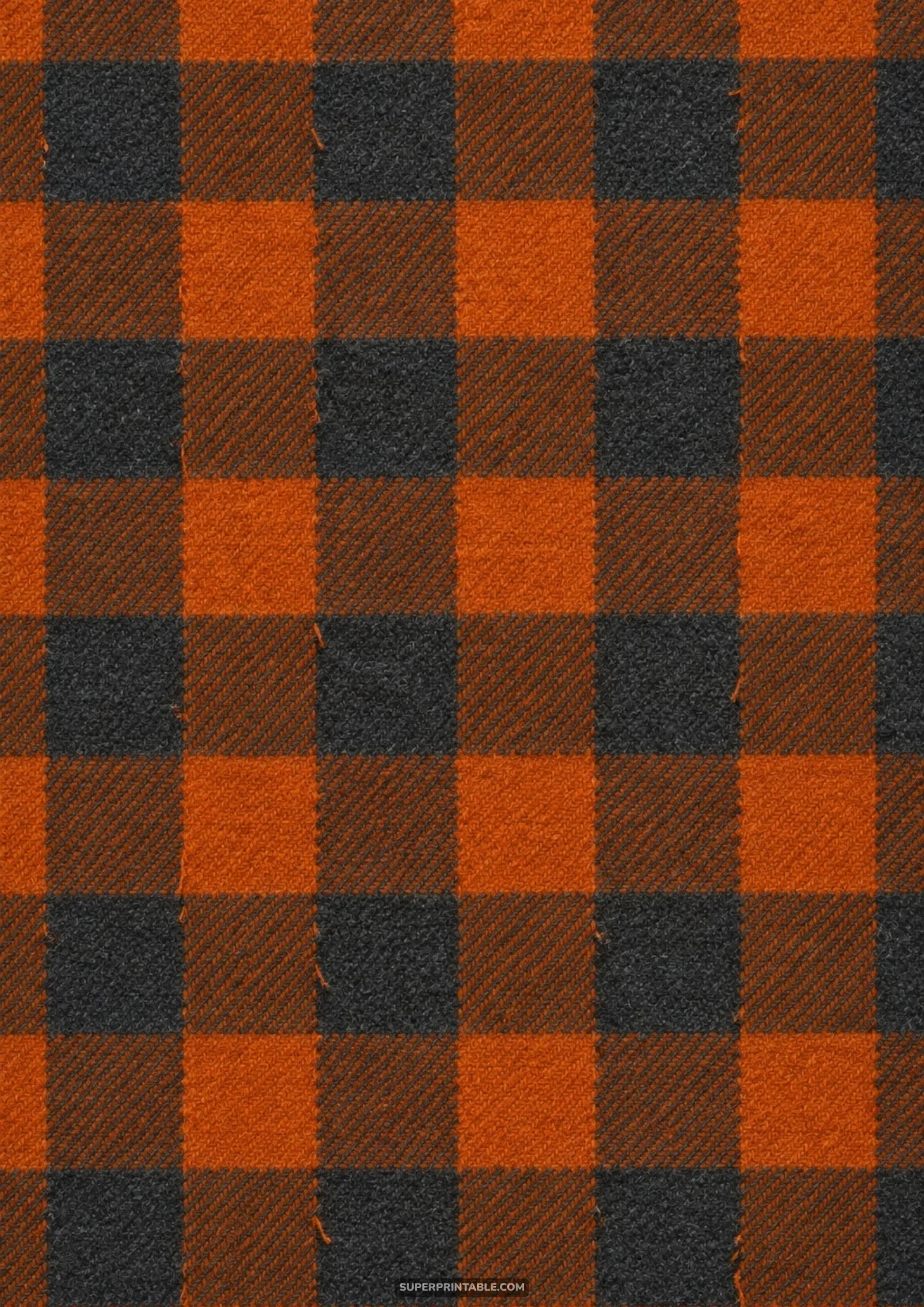 Classic buffalo check plaid pattern woven in cozy pumpkin orange and charcoal black flannel