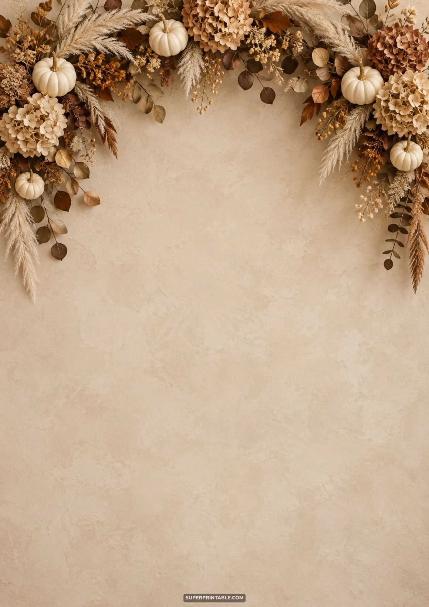 Miniature white pumpkins, dried hydrangea, and pampas grass forming a delicate arch on neutral plaster